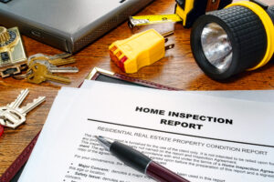 Home inspection report pen and flashlight on desk Flathead Valley Montana